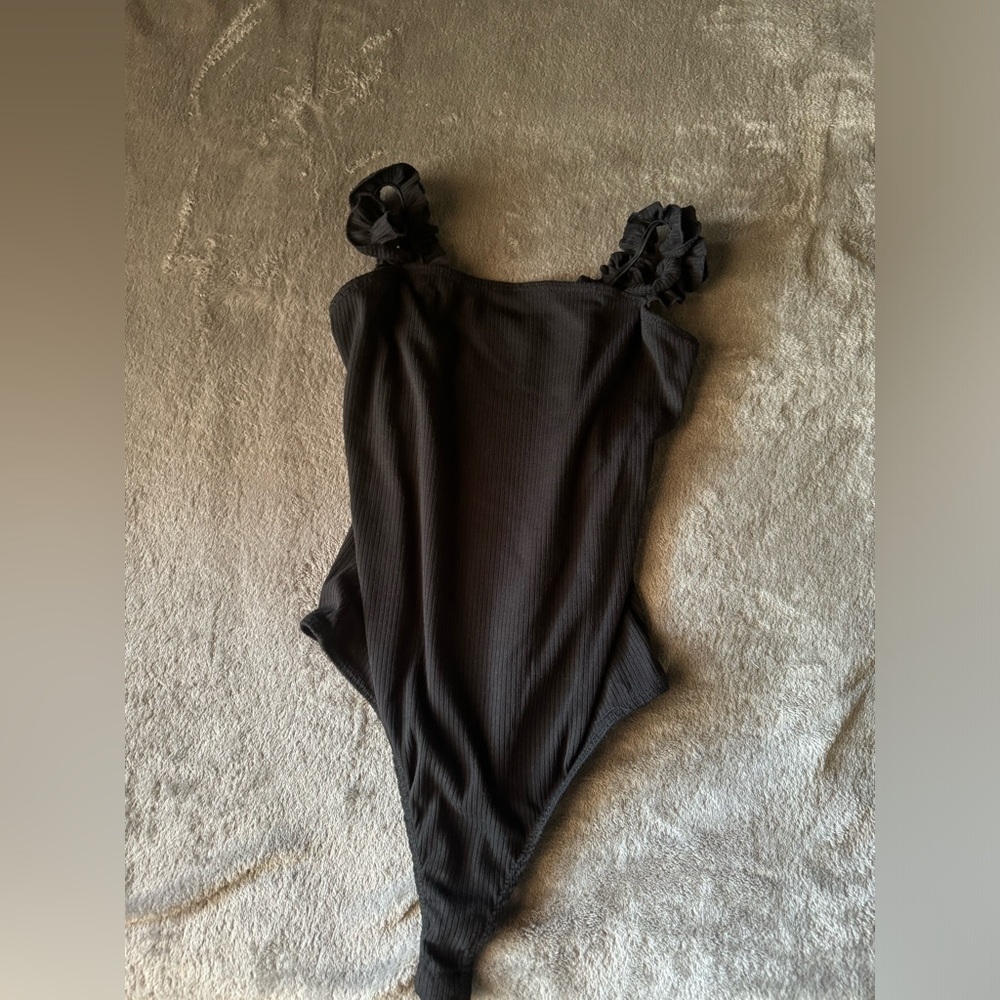 Black bodysuit with ruffle shoulder straps